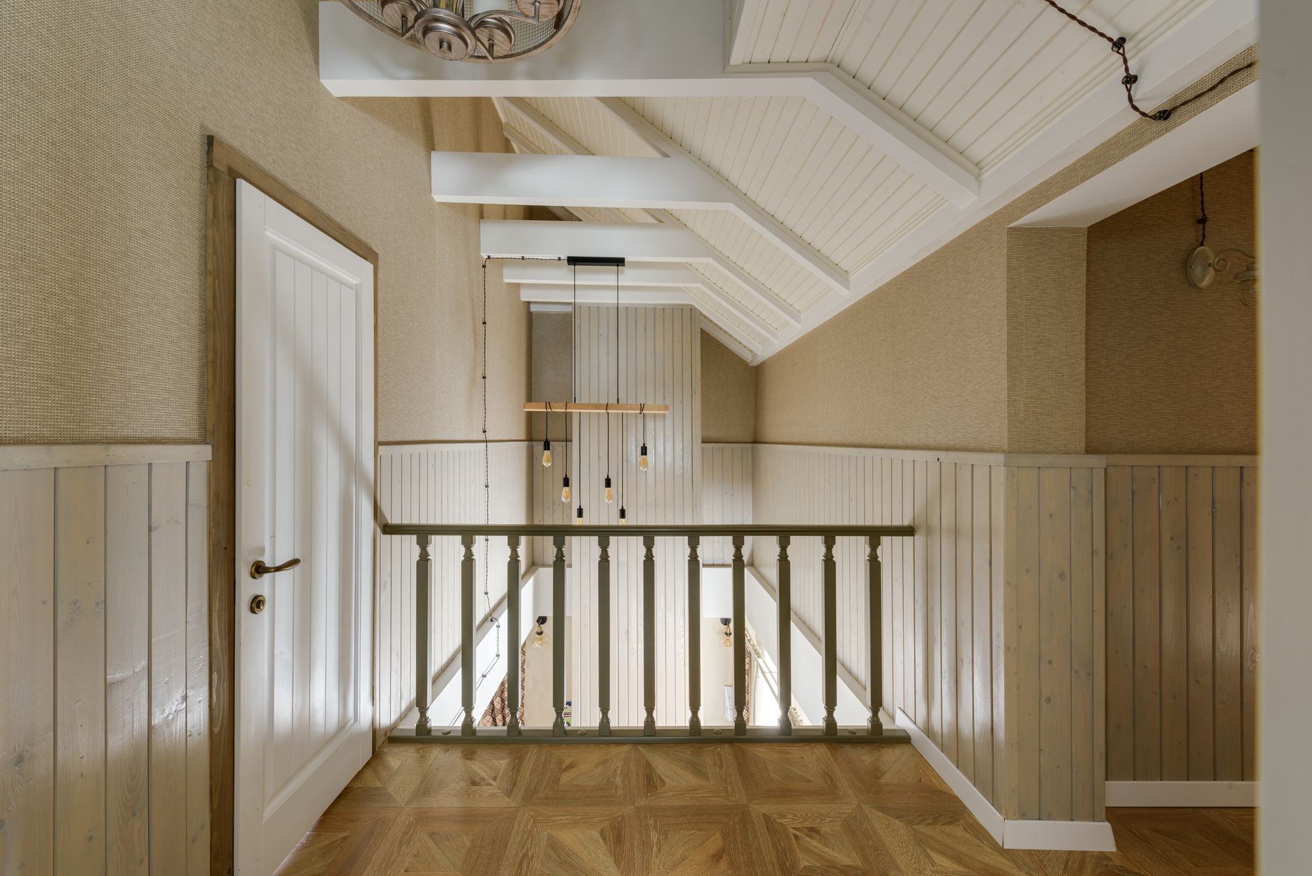 A beautifully designed interior showcasing wooden paneling and modern lighting in a hallway.