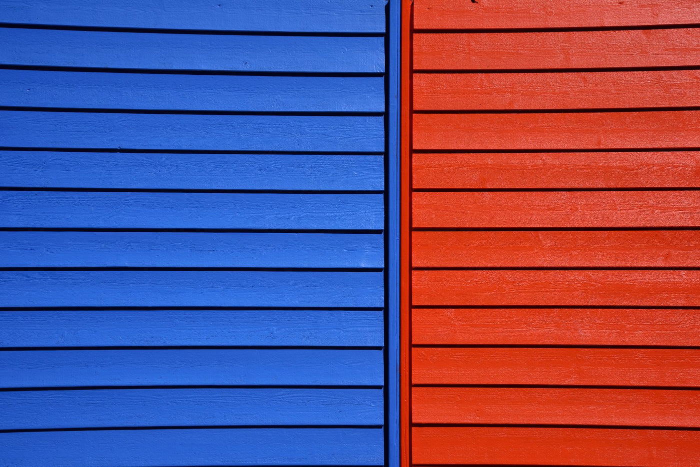 Vibrant blue and red wooden panels form a striking architectural detail.