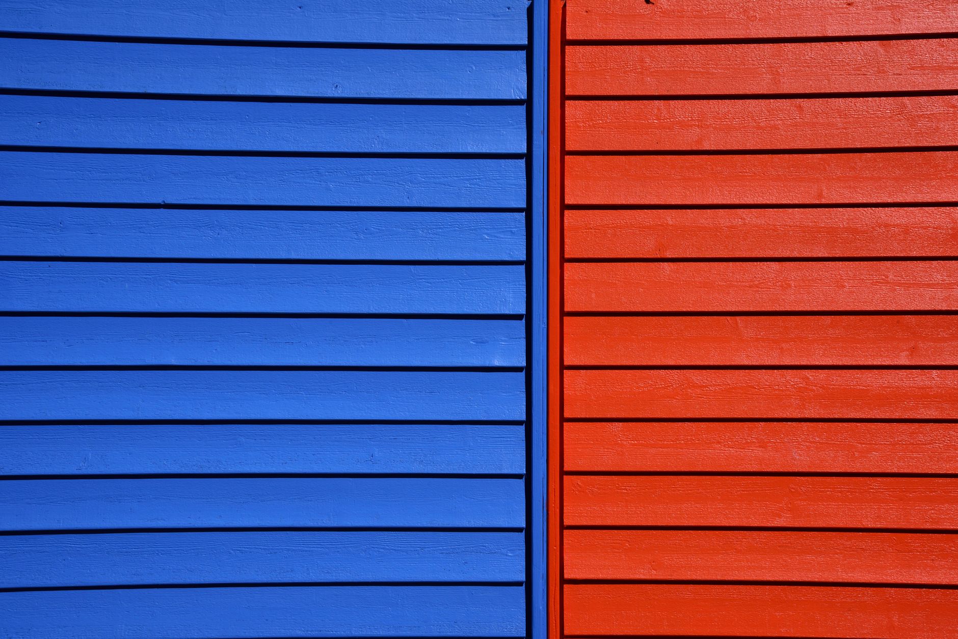 Vibrant blue and red wooden panels form a striking architectural detail.