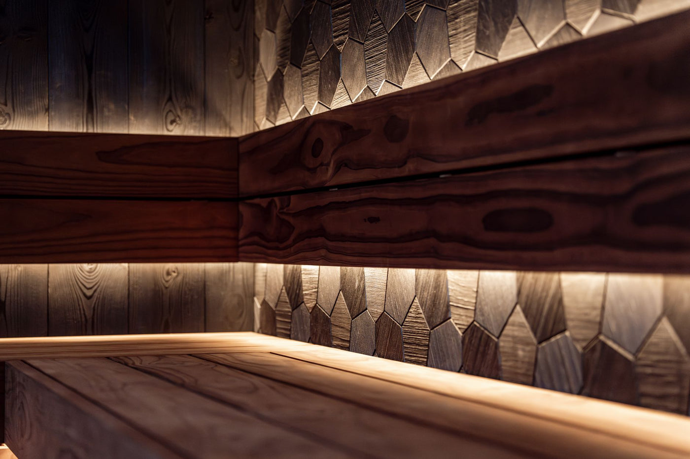 A sleek Nordic-style sauna interior featuring wood paneling and modern LED lighting.