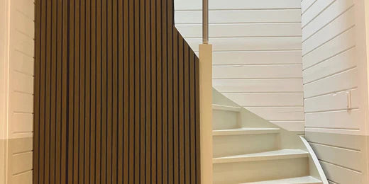 stairs with wooden wall panels