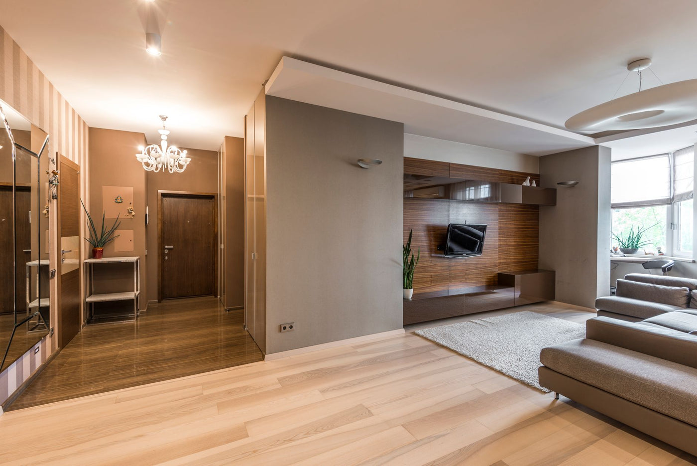 Spacious modern living room with elegant decor and natural lighting.